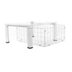 Adjustable Nedco washing machine riser with wire basket for easy access and stability.