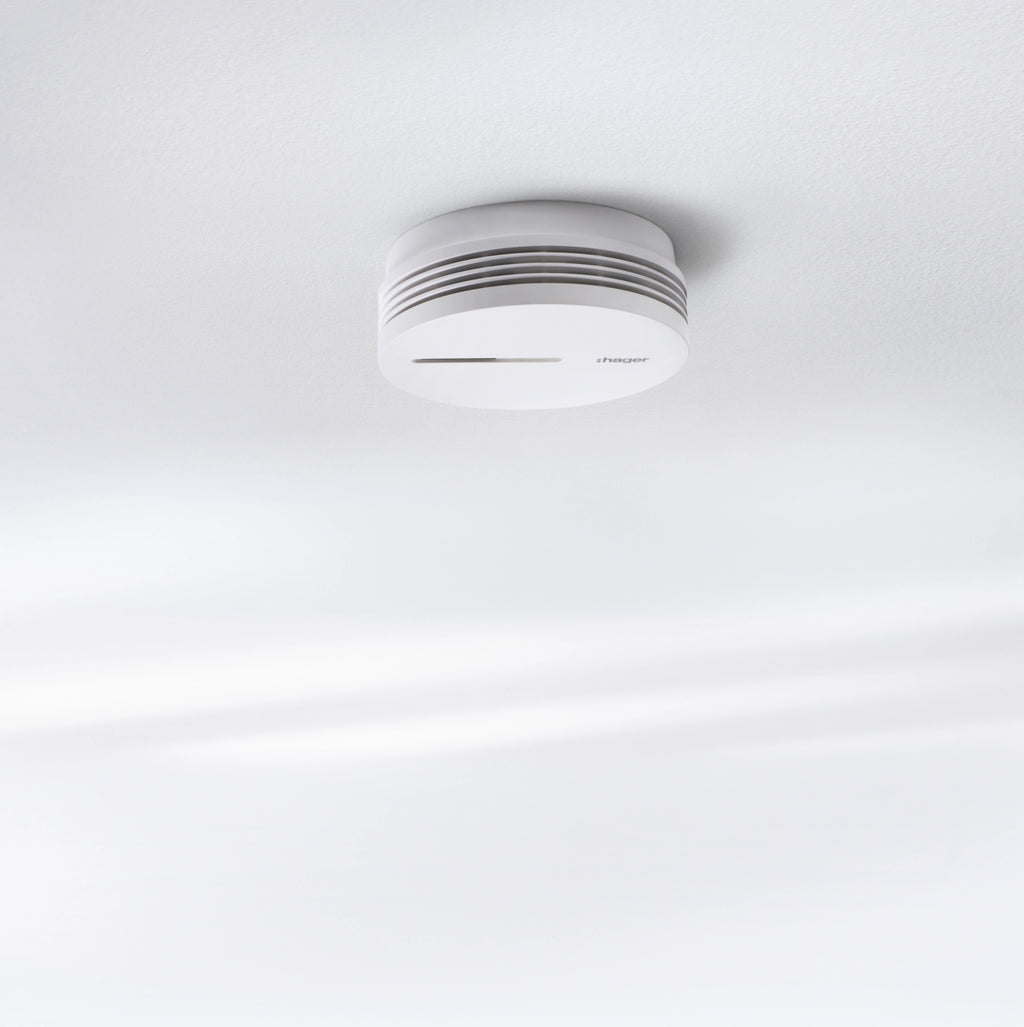 Hager TG600AL optical smoke detector, lithium-powered with 10-year lifespan, mounted on ceiling for fire safety detection