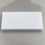 Teflon PTFE blocks in various sizes, used for industrial and DIY applications, shown in a close-up image