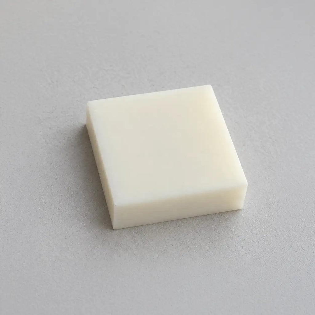 Teflon PTFE block from BouwmarktXL, showing a smooth, white rectangular plastic piece suitable for industrial use.