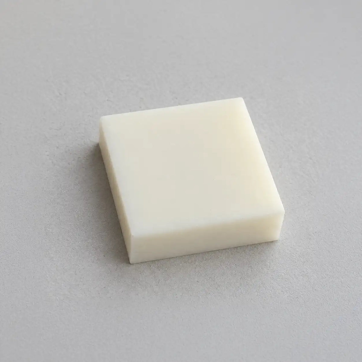 Teflon PTFE block from BouwmarktXL, showing a smooth, white rectangular plastic piece suitable for industrial use.
