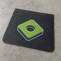 Black rubber mudflap with BouwmarktXL logo, placed on concrete surface, showcasing durable truck accessory branding.