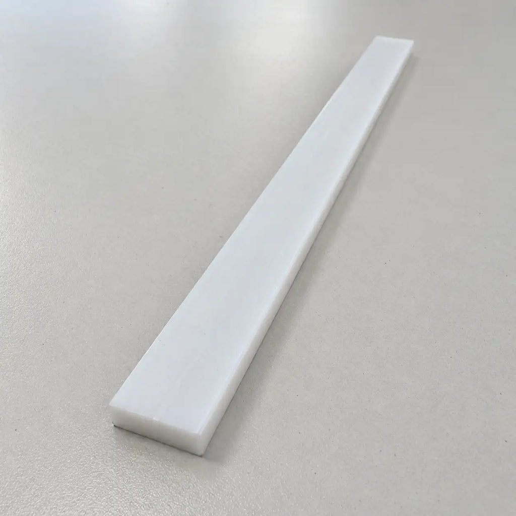 Custom Teflon (PTFE) strip from BouwmarktXL, showing a close-up of the smooth, flexible Teflon material for industrial use.